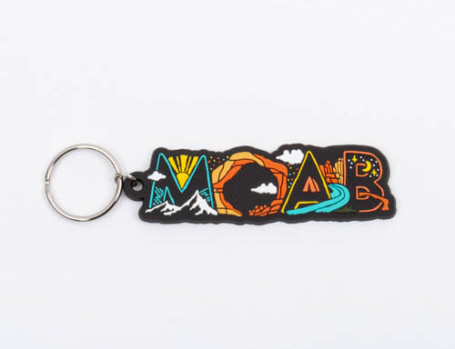 Moab keychain, MOAB embroidered in block letters with a sunburst, mountains, an arch and a river inside the letters, on a silver split ring.