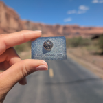 Back of the Moab Utah geometric sunset enamel pin showing the rubber clutch.