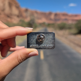 Back of the Moab Utah retro stripes enamel pin showing the rubber clutch.
