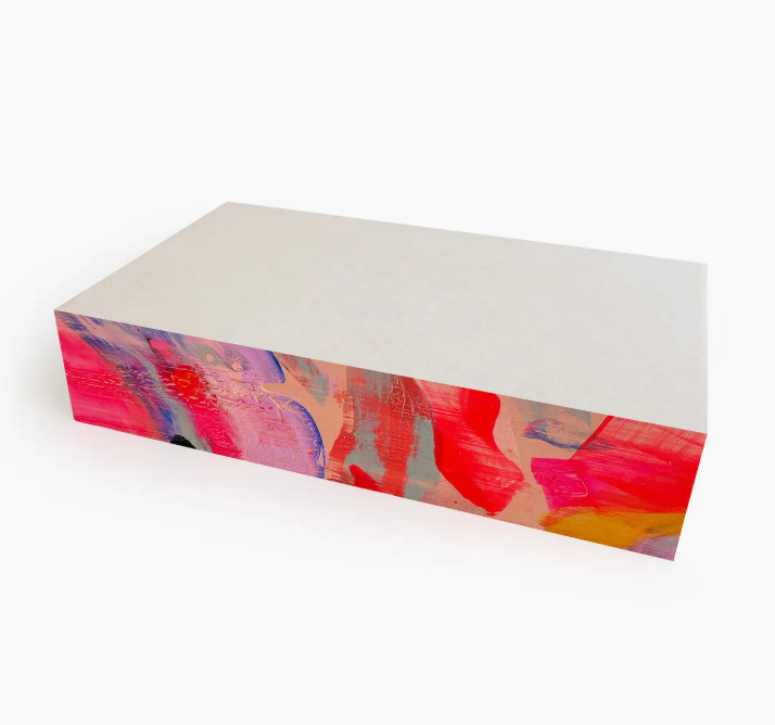 Moglea Candy Swirl Pad, a white notepad with hand-painted pink, red and blue swirled edges