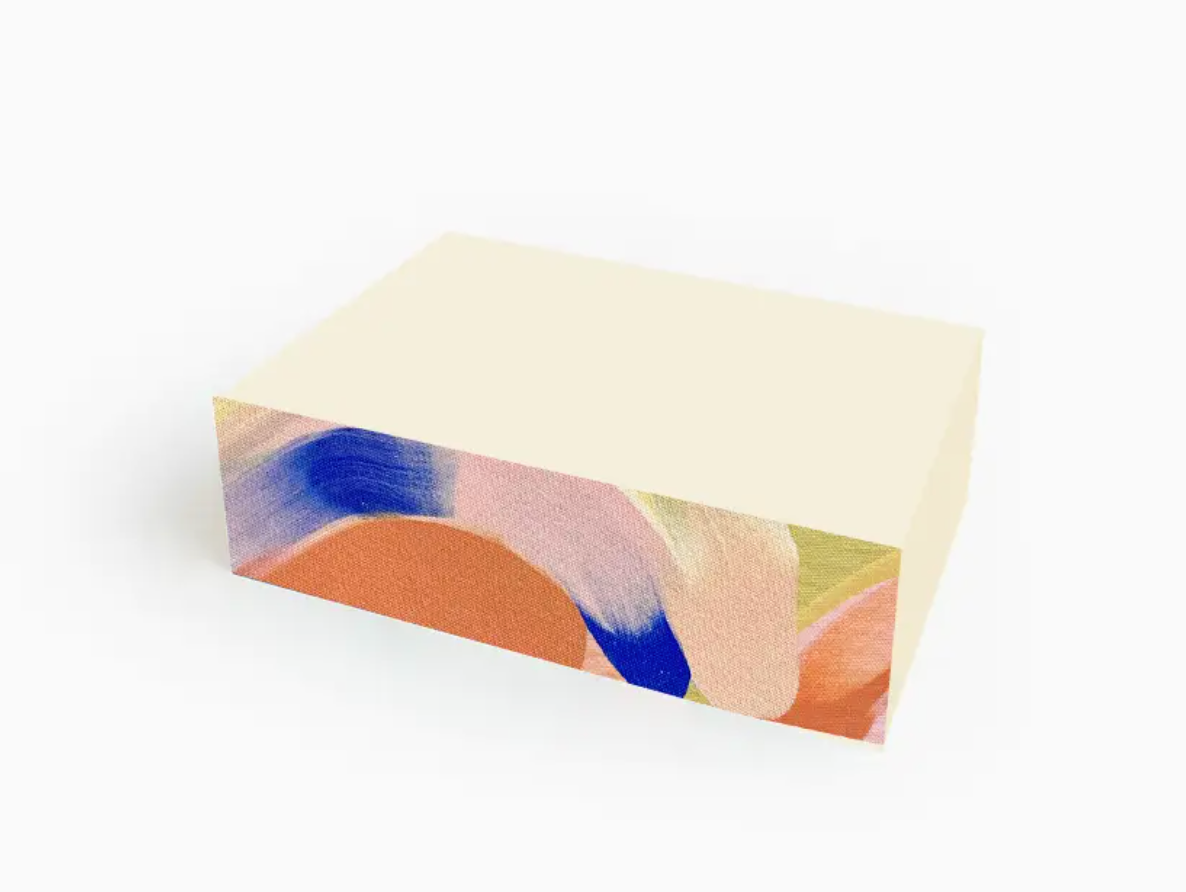 Moglea Citron Swirl Pad Small, a cream notepad with painted orange, pink and blue swirled edges