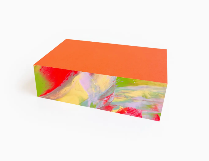 Moglea Hale Swirl Pad Small, an orange notepad with painted rainbow swirled edges