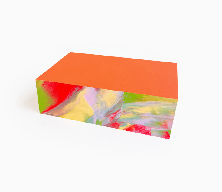 Moglea Hale Swirl Pad Small, an orange notepad with painted rainbow swirled edges