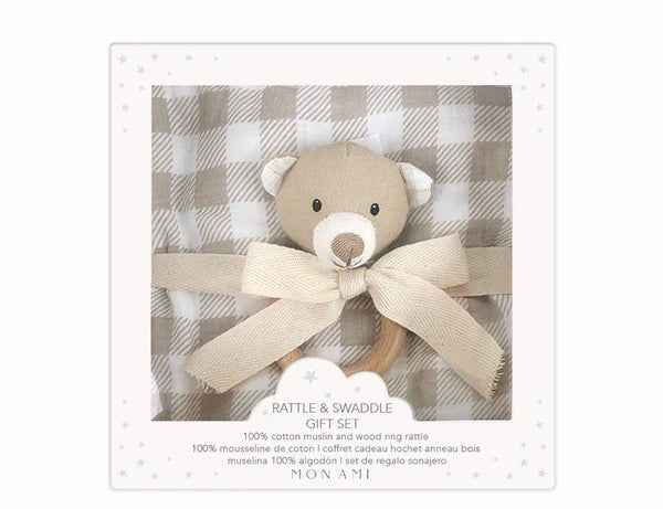 Mon Ami Muslin Swaddle & Rattle Gift Set in Gingham, a bear rattle on a tan gingham swaddle in a gift box