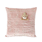Mon Ami My First Year Advent Pillow in Princess, a pink velvet pillow with numbered pockets and a bear