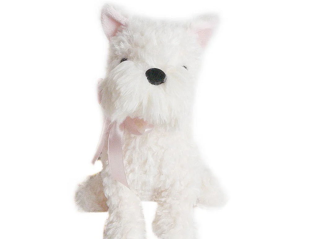 Mon Ami Wes The Westie, a fluffy white plush terrier with a pink ribbon, sitting
