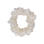 100% mulberry silk scrunchie in Ivory, small size, a soft ivory silk hair tie on a white background.