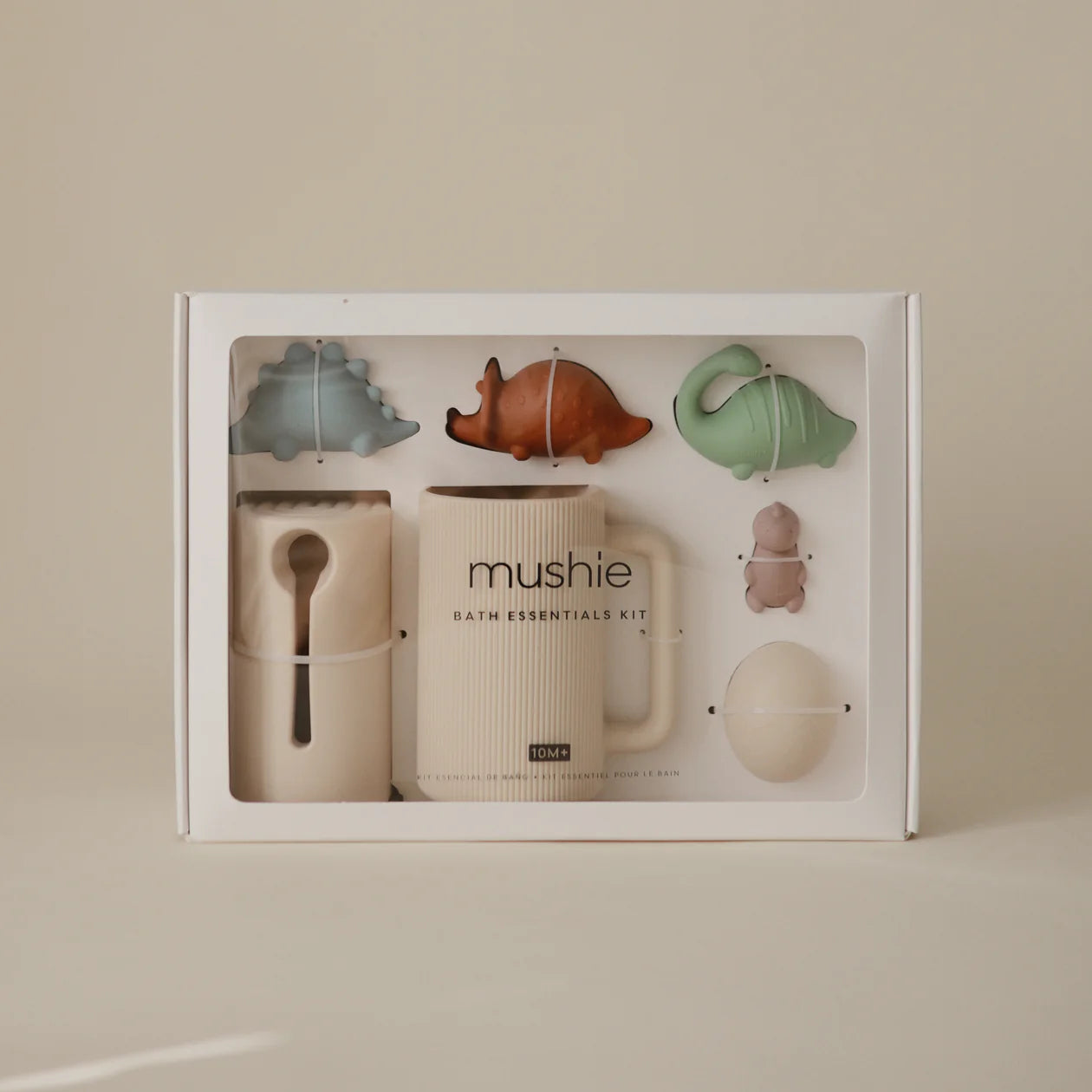 Mushie Bath Essentials Kit in Dino, boxed set shown on a cream background