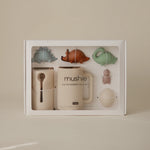 Mushie Bath Essentials Kit in Dino, boxed set shown on a cream background