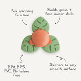 Mushie Dino Suction Spinner Toy with feature callouts: spinning function, motor skills, BPA free, suctions to smooth surfaces