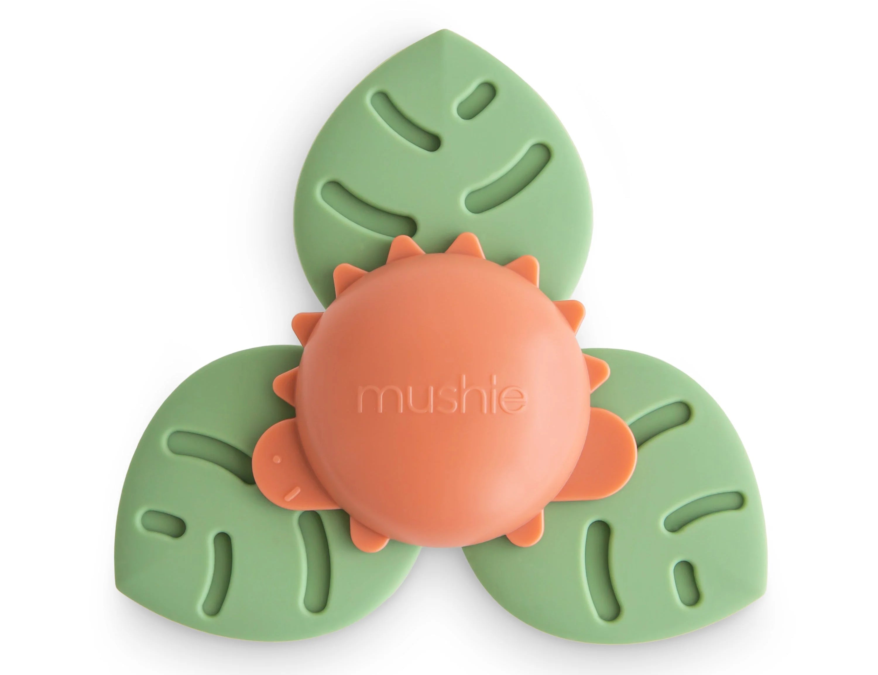 Mushie Dino Suction Spinner Toy, a coral dinosaur center with three green leaf-shaped spinner blades