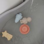 Mushie Mold Free Bath Play Set Pirate toys floating in a bathtub