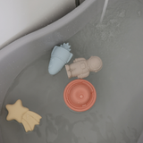 Mushie Mold Free Bath Play Set Pirate toys floating in a bathtub