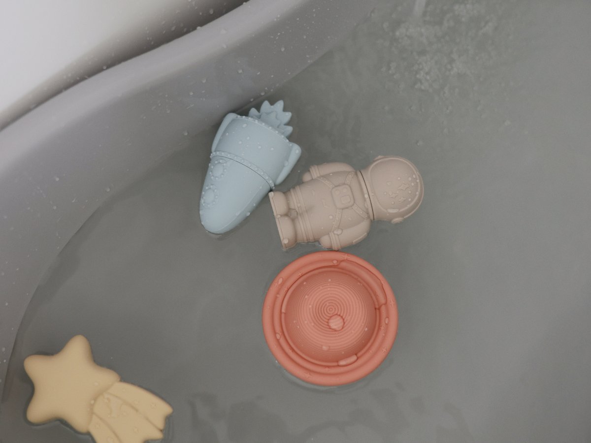 Mushie Mold Free Bath Play Set Pirate toys floating in a bathtub