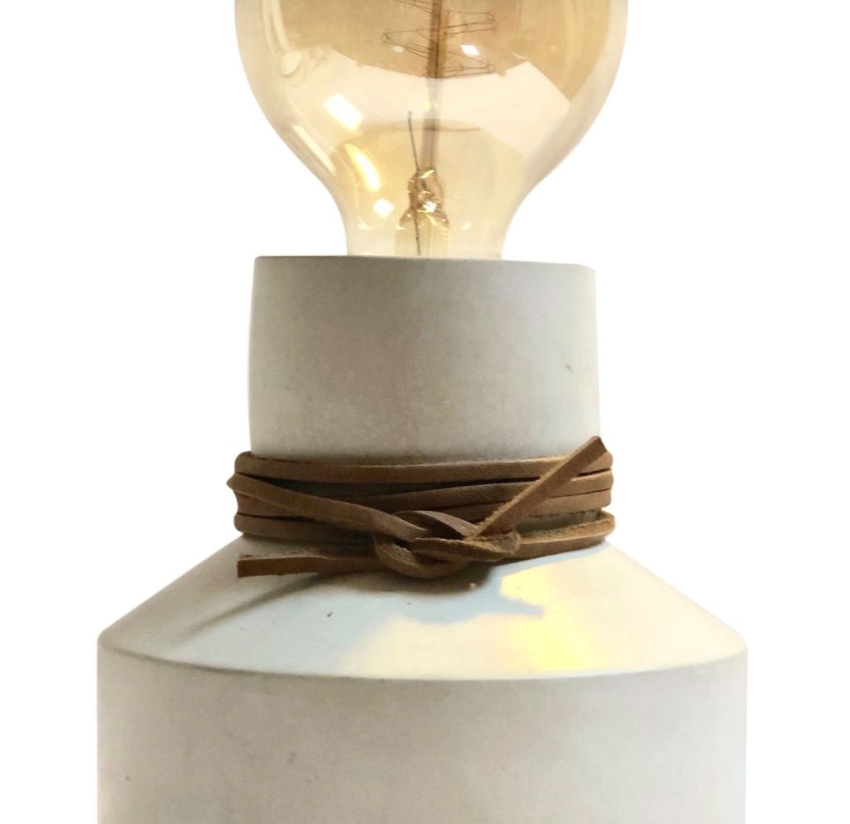 Natural by Hagelsieb Concrete Lamp, close-up of the gray concrete base with a leather cord wrap and Edison bulb