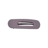 Oval lay flat claw clip in Grey Lilac, standard size, a matte dusty lilac hair claw clip with an open center, on a white background.