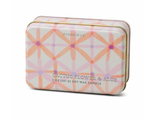 Cream Paddywax tin candle with peach and lilac starbursts, labelled Cactus Flower and Aloe