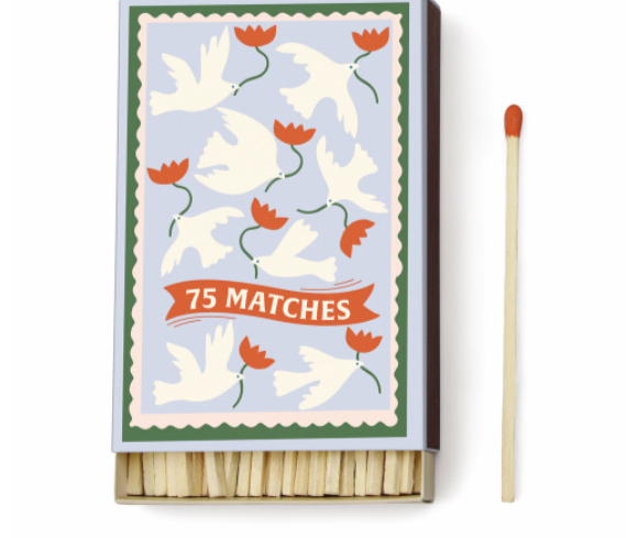 Pale blue Paddywax Dopo matchbox with cream doves and orange tulips in a green border
