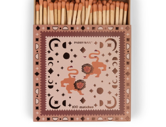 Dusty pink Paddywax matchbox with lions, moon phases and stars, terracotta match tips
