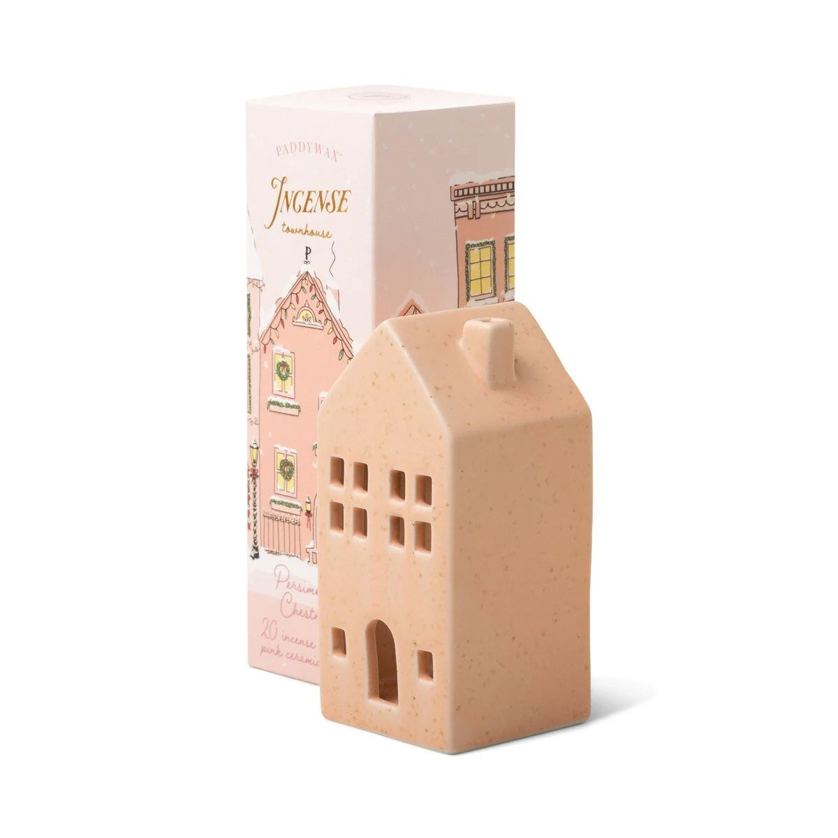 Paddywax Persimmon Chestnut Ceramic Incense Townhouse, a speckled pink ceramic house-shaped incense cone holder beside its illustrated holiday box