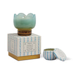 Paddywax Tulip Glass Candle in aqua glass on its blue and green box with a matching travel tin