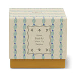Paddywax Tulip Glass Candle box with a blue and green pattern, notes of fresh air, water lily and bamboo