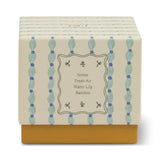 Paddywax Tulip Glass Candle box with a blue and green pattern, notes of fresh air, water lily and bamboo
