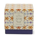 Paddywax Tulip Glass Candle box with an orange and purple floral pattern, 5.5 oz