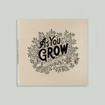Paige Tate & Co As You Grow Memory Book, cream linen cover with black botanical lettering