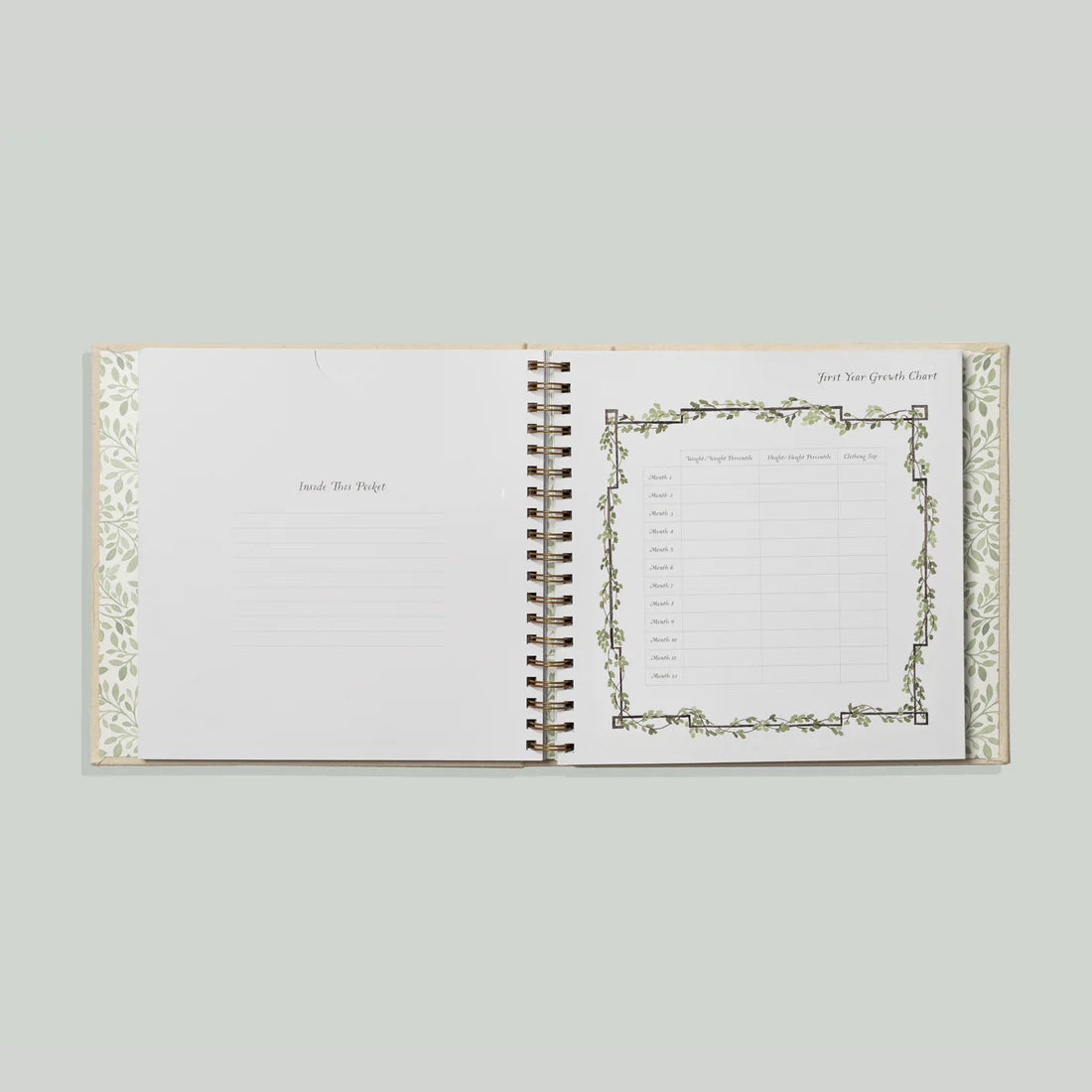 Paige Tate & Co As You Grow Memory Book, open spiral-bound spread with a growth tracking chart and botanical border