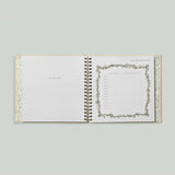 Paige Tate & Co As You Grow Memory Book, open spiral-bound spread with a growth tracking chart and botanical border