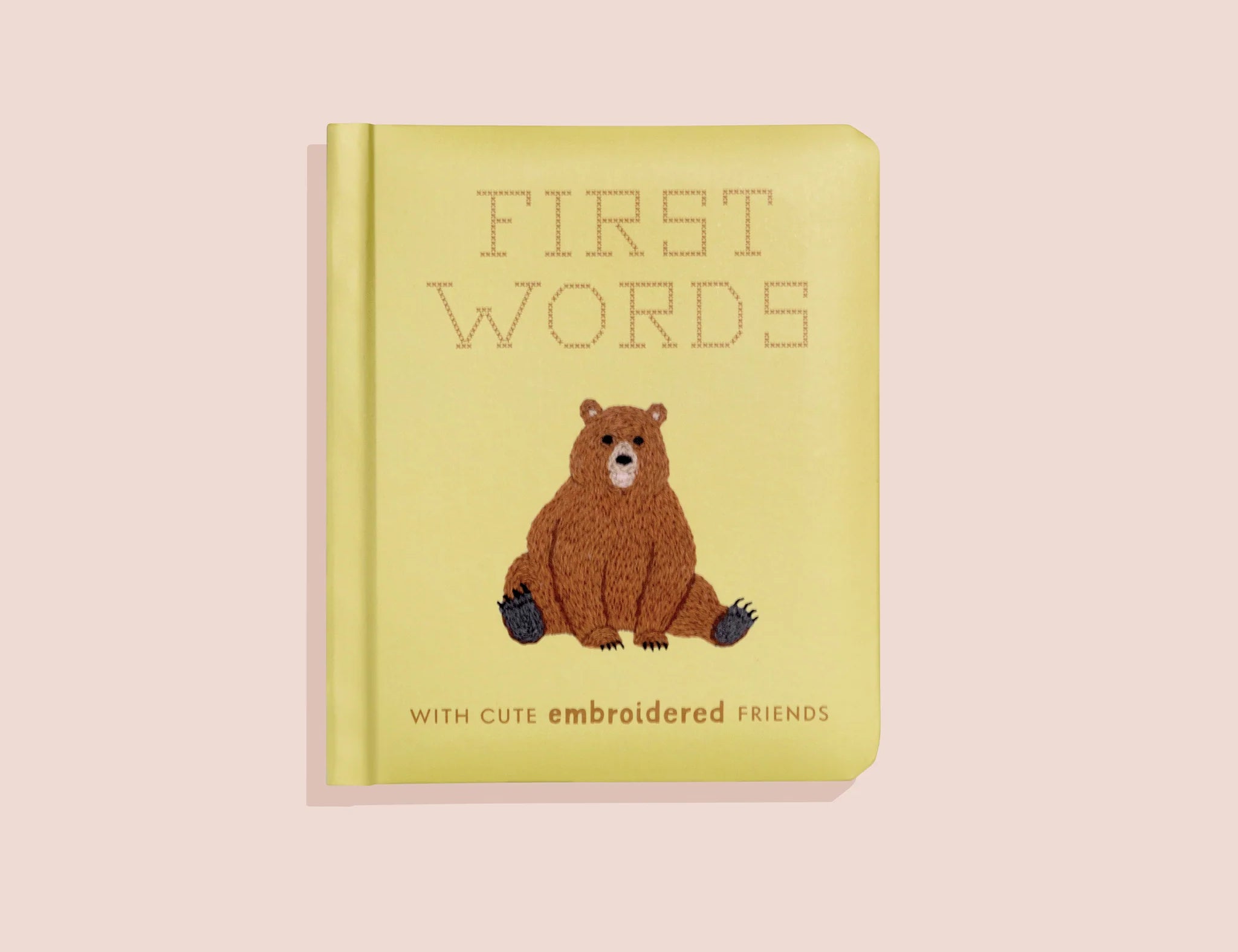 Paige Tate & Co First Words Embroidered Friends Book, a yellow board book with an embroidered bear on the cover