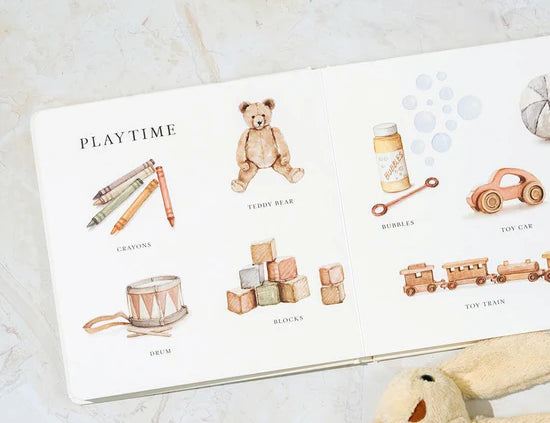 Paige Tate & Co Our Big Book of Words open to the Playtime page with a plush bunny