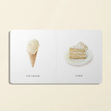 Paige Tate & Co Our Little Library Vol. 2 board book open to Ice Cream and Cake pages