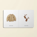 Paige Tate & Co Our Little Library Vol. 2 board book open to Sweater and Mittens pages