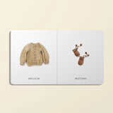 Paige Tate & Co Our Little Library Vol. 2 board book open to Sweater and Mittens pages