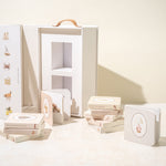 Paige Tate & Co Our Very Little Library carry box open with the mini board books laid out