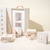Paige Tate & Co Our Very Little Library carry box open with the mini board books laid out