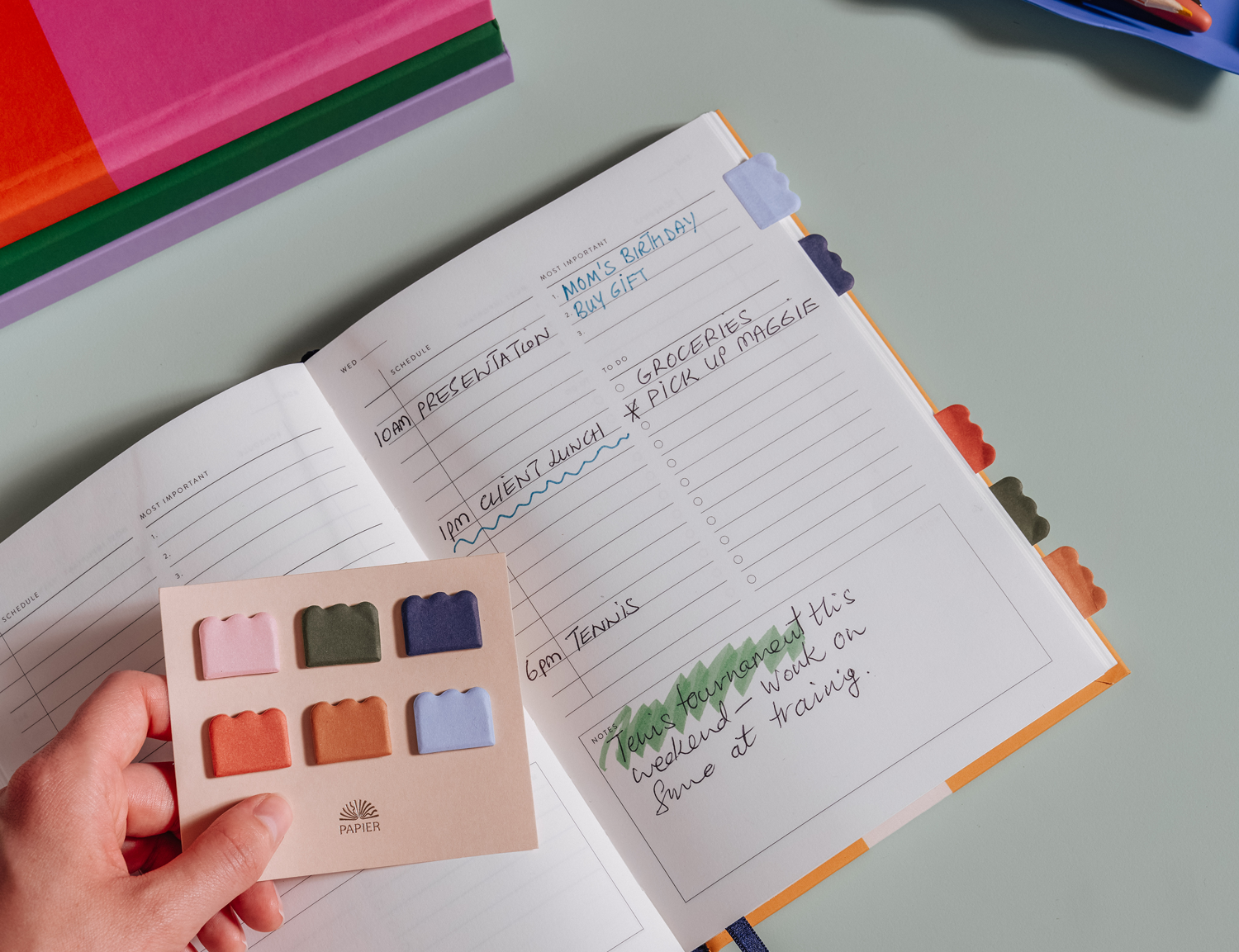 Papier Cloud Sticky Index Tabs in muted green, blue and pink being used in a planner