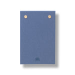 Papier Fabric Hardcover Notepad closed, showing the blue fabric cover with gold studs