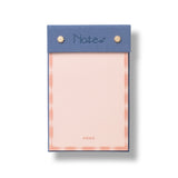 Papier Fabric Hardcover Notepad in pink with a blue fabric header reading Notes and gold studs