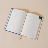 Papier Finance Planner Four Leaf open to a budget tracking table page