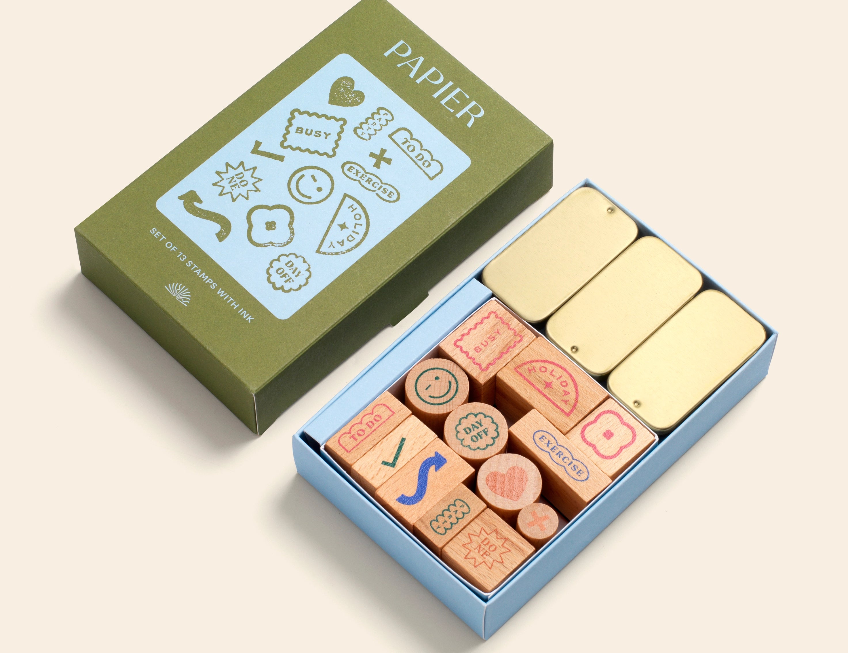 Papier Good Day Stamp Planner Set, an olive green box of wooden rubber stamps and gold ink pads