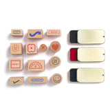 Papier Good Day Stamp Planner Set stamps and three ink pads laid out on white