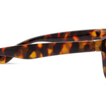 Peepers 18th Hole Sunglasses in Tortoise, side view of the mottled brown temple arm