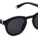 Peepers Beverly Shores Sunglasses in black, round frames with dark lenses, angled view
