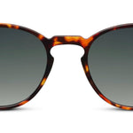 Peepers Boho II Sunglasses in tortoise, close-up of the round frames and green lenses