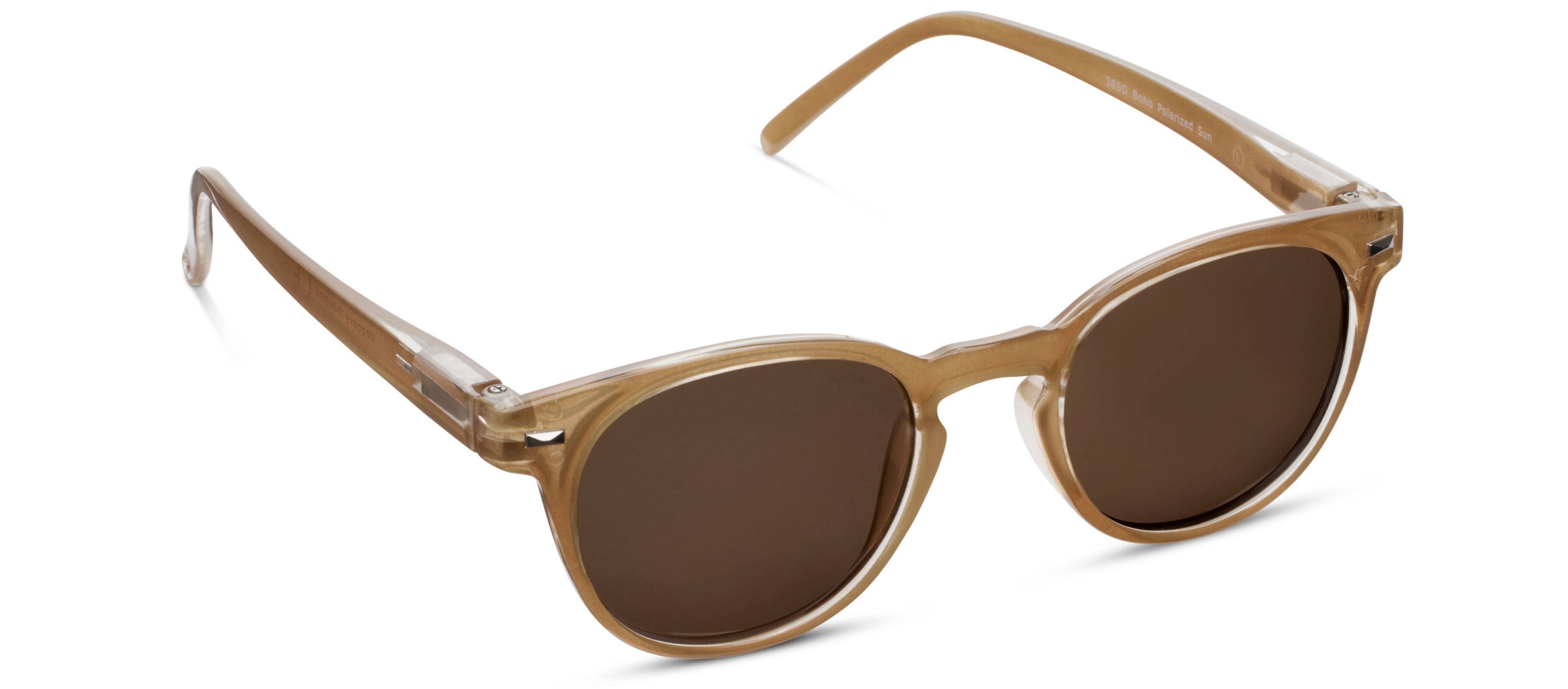 Peepers Boho Sunglasses in Amber, translucent amber round frames with brown lenses, angled view