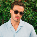 Man in a light blue shirt wearing Peepers Deep Dive Sunglasses in Fog outdoors