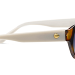 Peepers En Route Sunglasses in Tortoise/White, side view of the white temple arm with gold accent